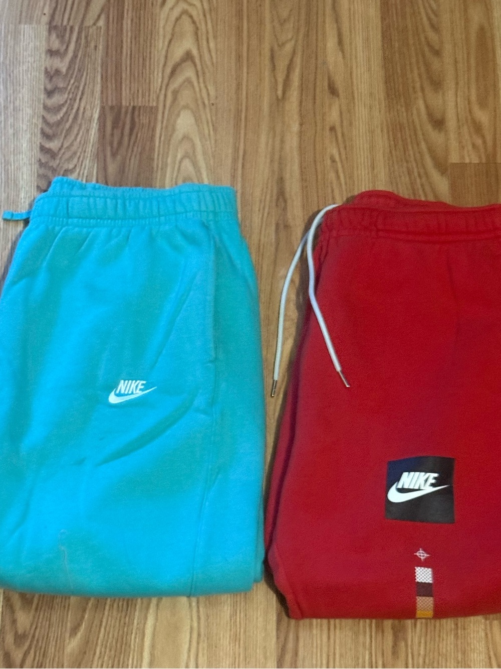 Nike Men's NSW Basketball AR Fleece Joggers (Red and Turquoise 2-Pack)